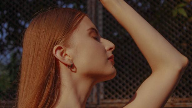 A person in a calm, seated meditation pose.